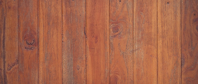 Warm medium tone wood floor with aged look and knots